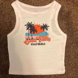 white beachy cropped tank top from Hollister in a car woman.
